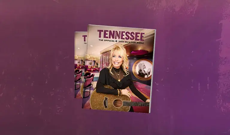 Tennessee vacation guide magazine featuring dolly parton on the cover